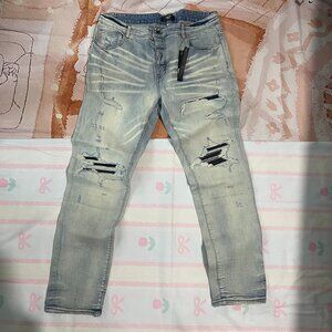 AMIRI Distressed Leather Patch Skinny Jeans